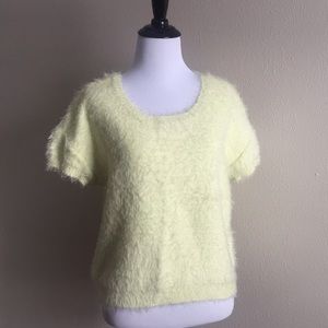 Jennifer Lopez yellow short sleeve sweater